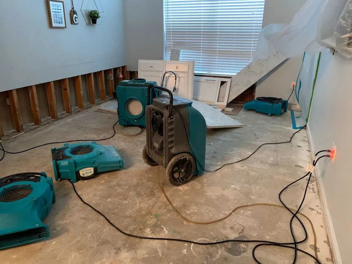 Dehumidifier in flood-cut room for Water Damage Restoration in Benbrook